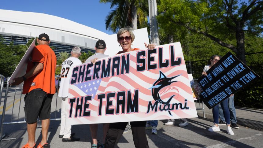 A handful of disgruntled Marlins fans protest the team following the Luis Arraez trade