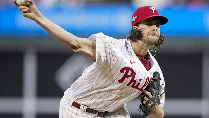 Aaron Nola returns to Phillies on 7-year deal, AP source says