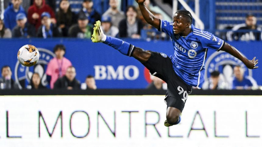 Acosta scores on a penalty kick in second-half stoppage time to help Cincinnati tie Montreal 1-1