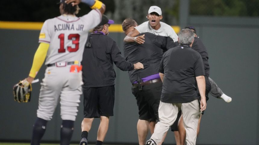 Acuna fends off fans, ties career highs with 4 hits and 5 RBIs in Braves' 14-4 rout of Rockies