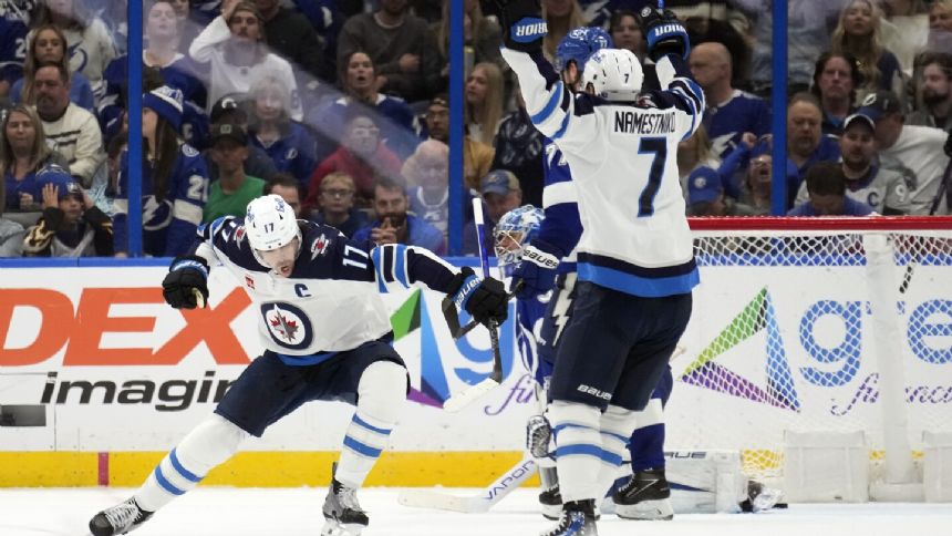 Adam Lowry scores in OT, Jets beat Lightning 3-2 to extend winning streak to 4 games