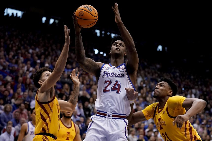 Adams scores late, No. 2 Kansas edges No. 14 Iowa St 62-60