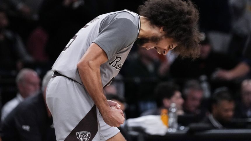 Adams-Woods scores 17 points and St. Bonaventure beats Oklahoma State 66-64 in the Legends Classic.