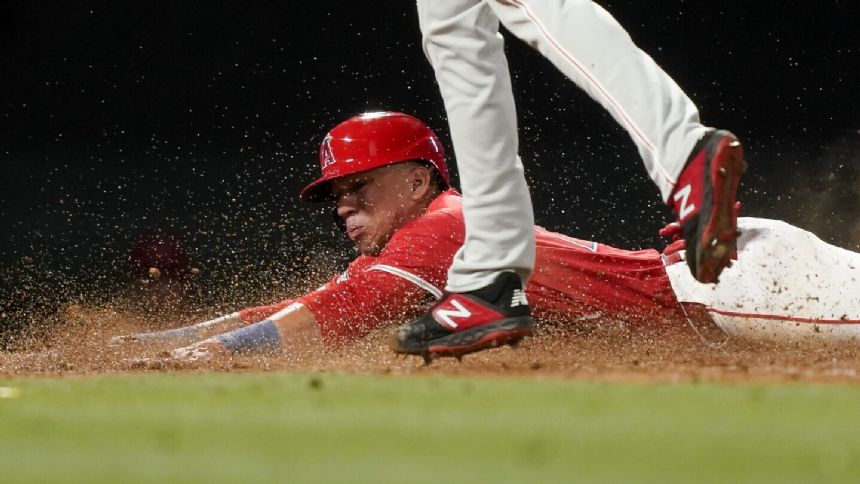 Angels score two on wild pitch and throwing error, beat Phillies 6-5 and snap 4-game skid