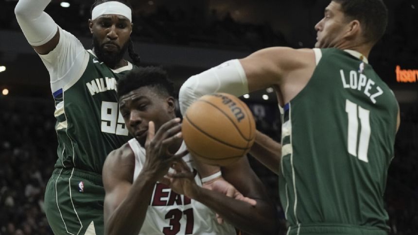 Antetokounmpo, Lillard help Bucks build big lead, hold off Heat in playoff rematch