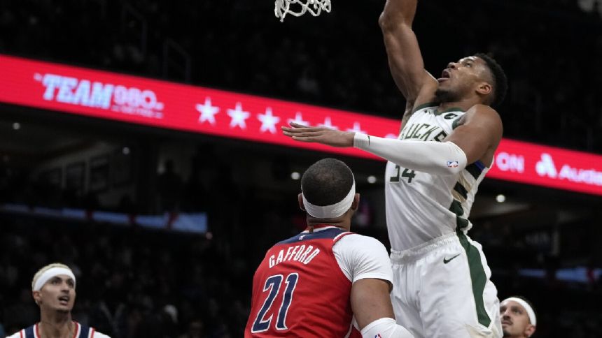 Antetokounmpo scores 42 on 20-of-23 shooting, leading the Bucks to a 142-129 win over the Wizards
