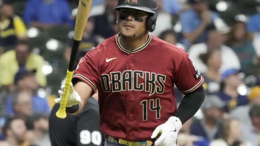 Arizona catcher Gabriel Moreno leaves Game 2 of Wild Card Series after backswing hits his helmet