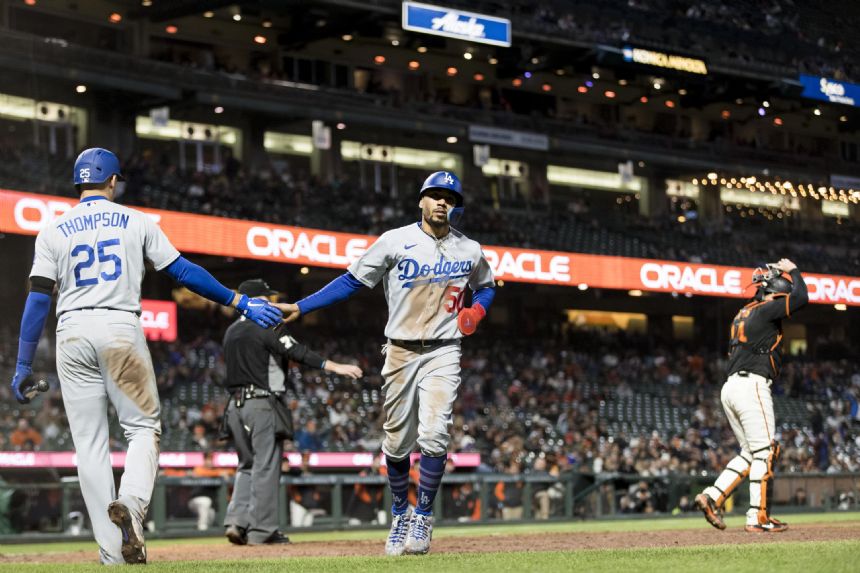 Betts, Muncy lead Dodgers to 4-3 win over Giants in 10