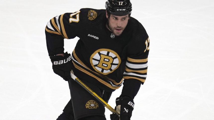 Boston Bruins forward Lucic to be arraigned on assault charge after wife called police to their home
