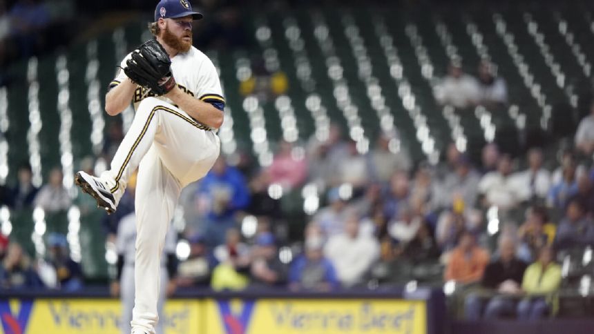 Brandon Woodruff tosses a 6-hitter as the Milwaukee Brewers pound the Miami Marlins 12-0