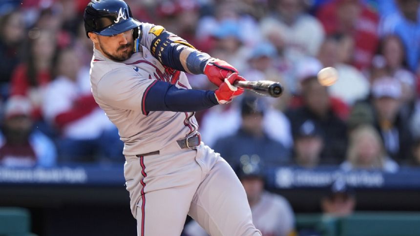 Braves rally for seven in the eighth to begin defense of NL East crown with 9-3 win over Phillies
