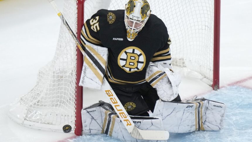 Bruins get 2 short-handed goals in 1st period, beat Canucks 4-0 in matchup of NHL's top 2 teams
