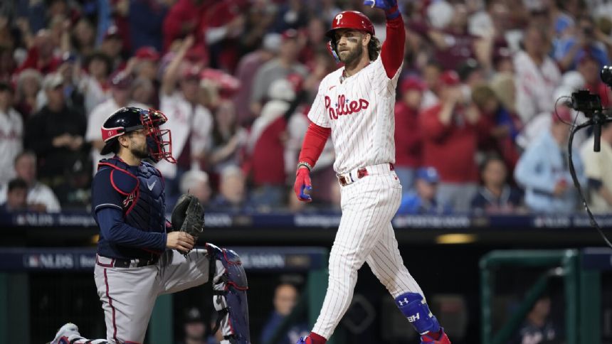 Bryce Harper slugs 2 more homers as Phillies pound Braves 10-2 in Game 3 of NL Division Series