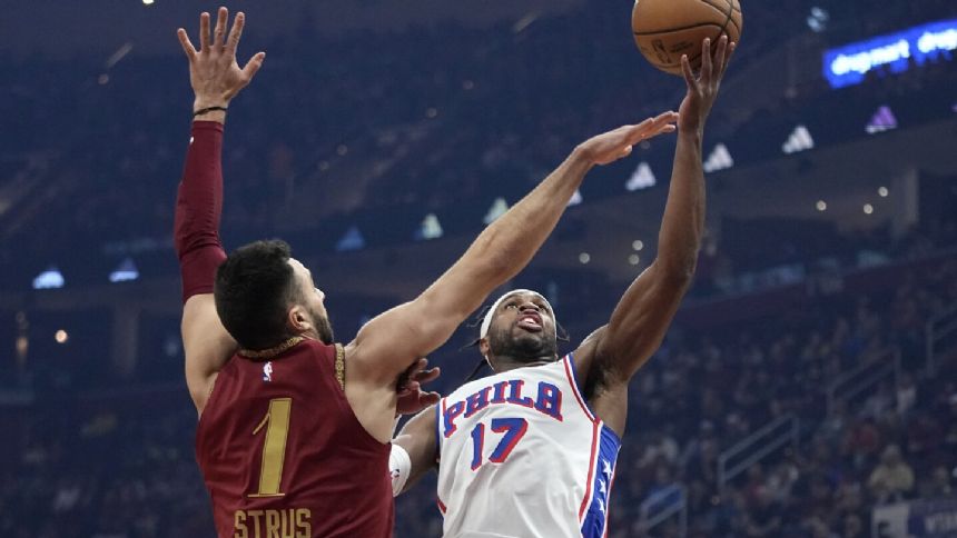 Buddy Hield scores 24 as 76ers end Cavaliers' 9-game winning streak with 123-121 victory