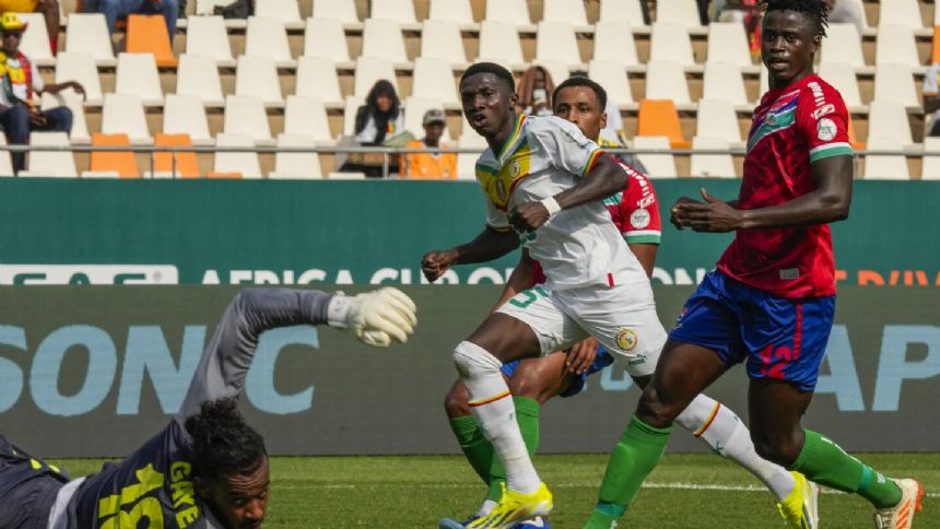 Camara scores twice as Senegal starts Africa Cup defense with comfortable 3-0 win over Gambia