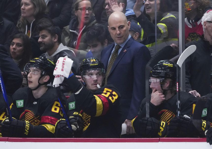 Canucks beat Blackhawks 5-2 in Tocchet's debut as coach