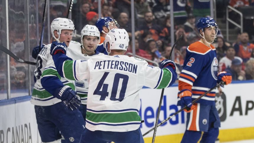 Canucks maintain their early season dominance over the Oilers with 4-3 win