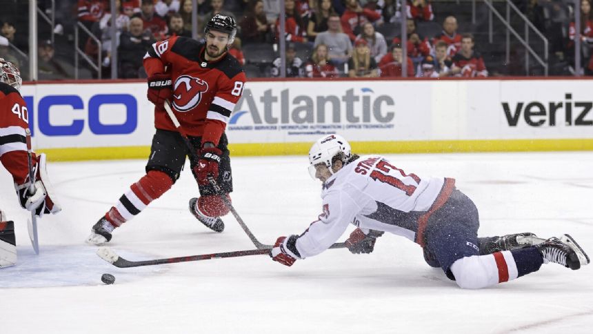 Capitals score three in third to rally for 6-4 win over Devils