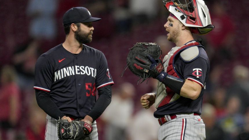 Castro homers, makes pair of spectacular catches to lead Twins over Reds 7-0