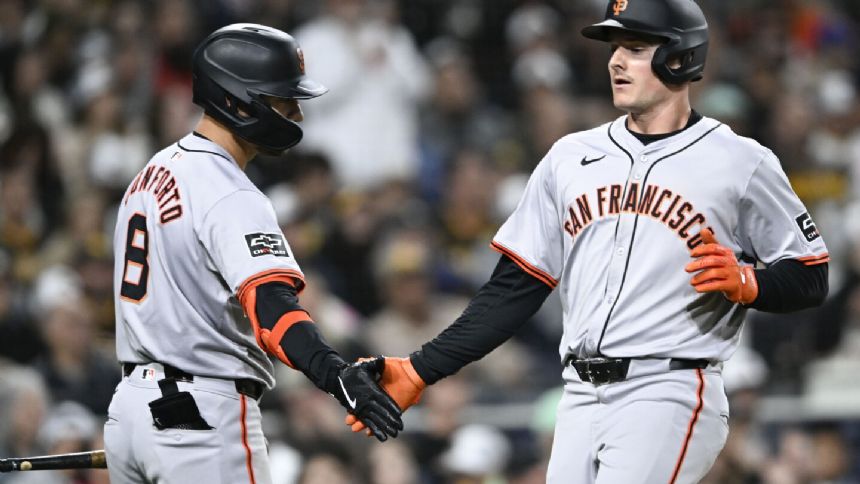 Chapman homers twice and drives in 5 runs to help Harrison and the Giants beat the Padres 8-3