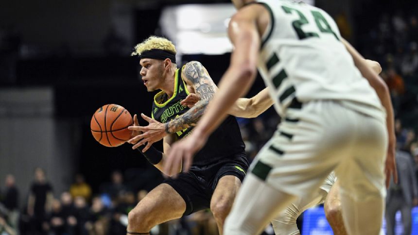 Chris Youngblood scores 17, No. 25 South Florida beats Charlotte to 76-61 for 14th straight victory