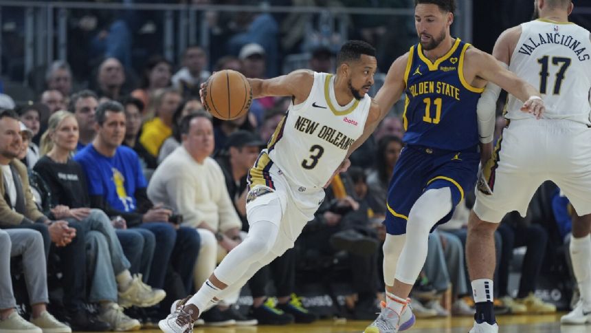 CJ McCollum scores 28 points as Pelicans hold off Warriors 114-109 to help playoff position