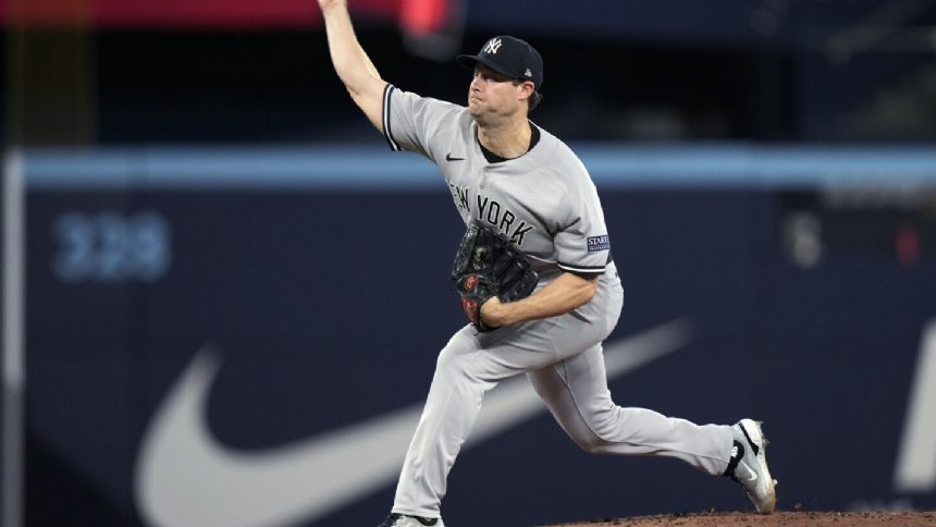 Cole pitches 2-hitter to near ERA title, Judge homers twice and Yankees beat Blue Jays 6-0