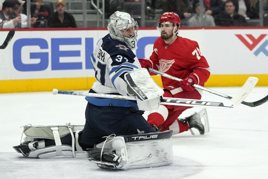 Connor Hellebuyck stops 33 shots, Jets beat Red Wings 3-0