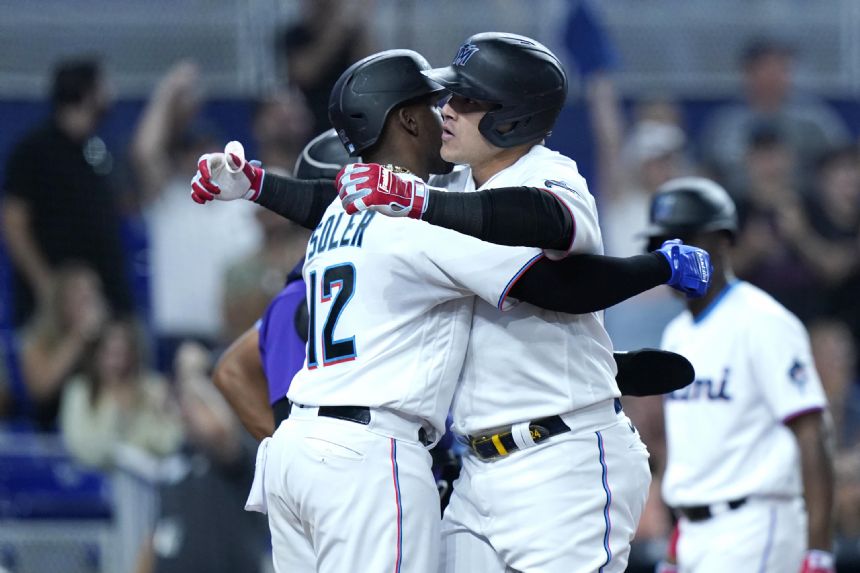 Cooper's go-ahead double in 8th lifts Marlins past Rox 9-8