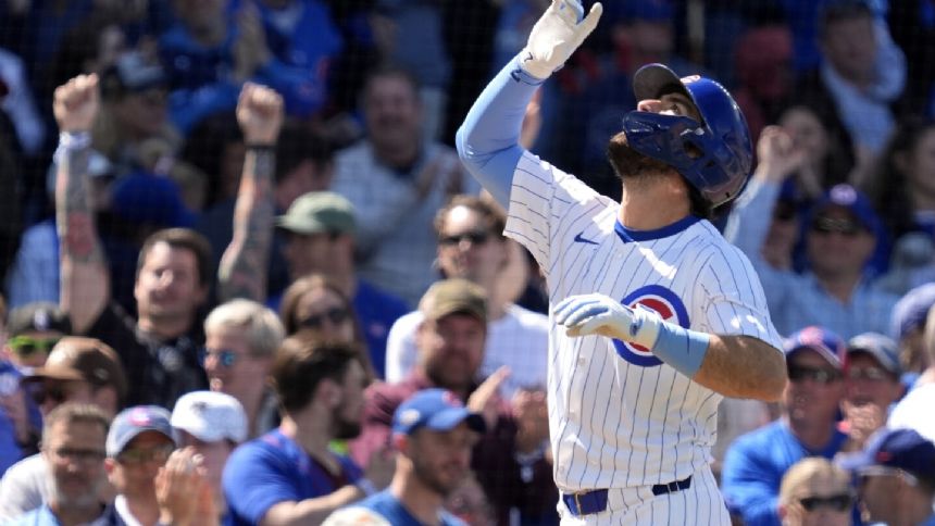 Cubs place SS Dansby Swanson on the injured list with a sprained right knee as OF Suzuki returns