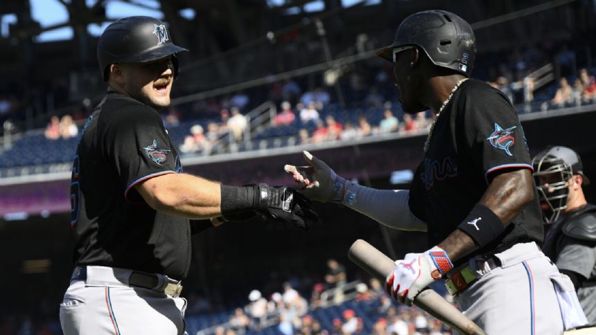 Cueto wins in his return as Burger hits 2 of the Marlins' 4 home runs in win over the Nationals
