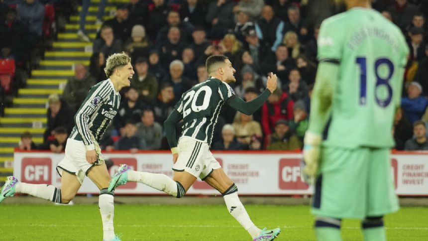 Dalot scores winner as Man United beats Sheffield United 2-1 'on a sad day' after Charlton's death