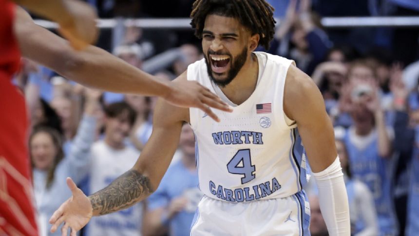 Davis scores 21 points as No. 4 North Carolina beats Louisville 86-70 for 7th straight win