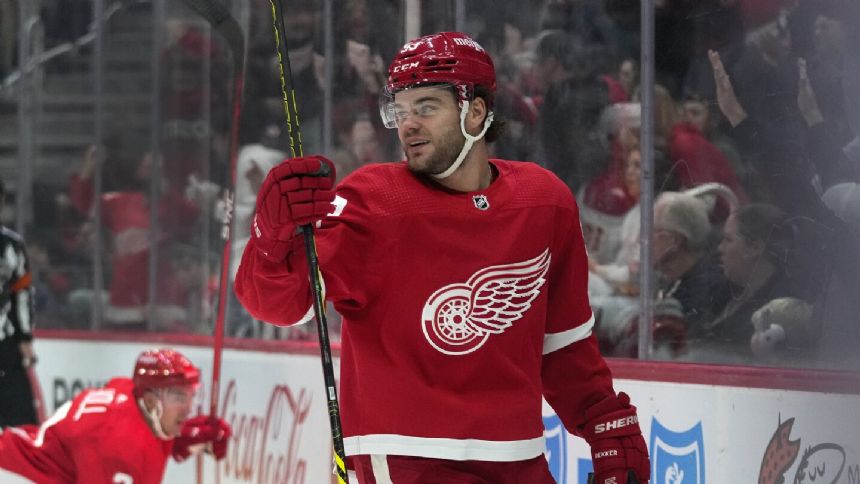 DeBrincat notches hat trick, Red Wings win fifth straight by downing Flames 6-2
