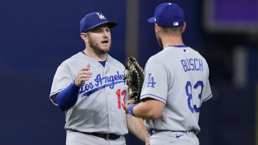 Dodgers credited with a run when Marlins ball boy picks up a ball that was in play