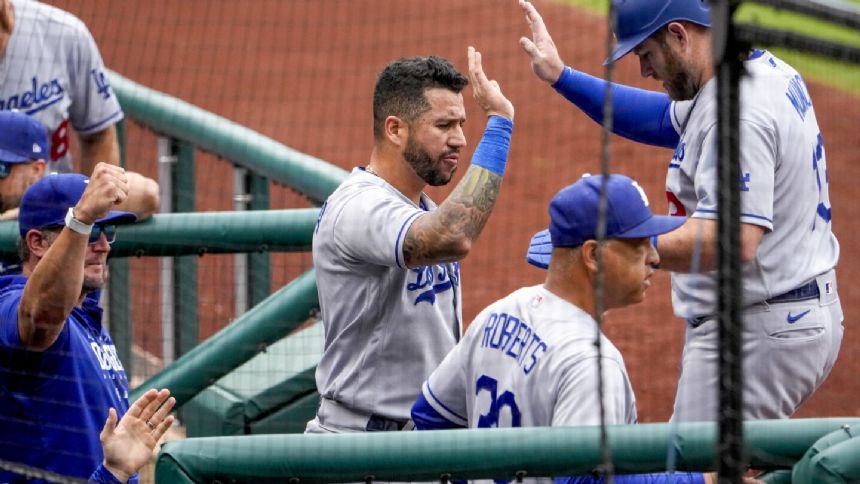 Dodgers outlast rain, defeat Nationals 7-3 to extend NL West lead to 13 games