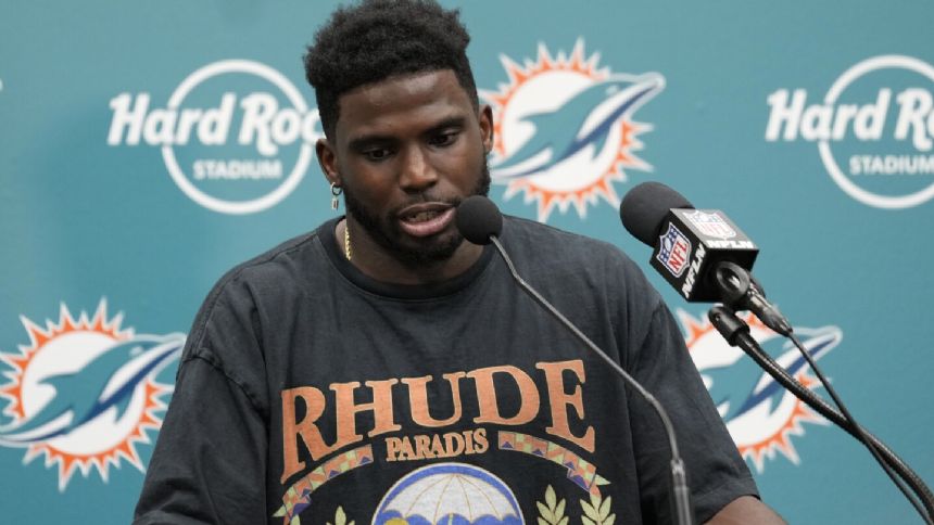Dolphins' Tyreek Hill returns to practice two days after fire at his home