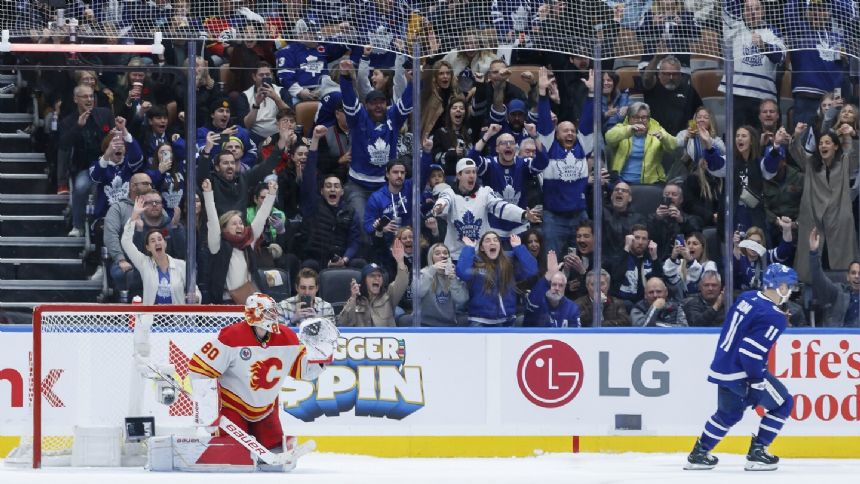 Domi scores shootout winner to lift Maple Leafs to 5-4 win over Flames