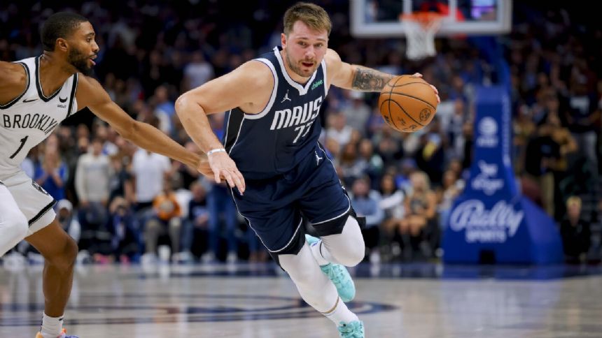 Doncic scores 49 and hits a late right-handed 3-point heave as the Mavericks beat the Nets 125-120