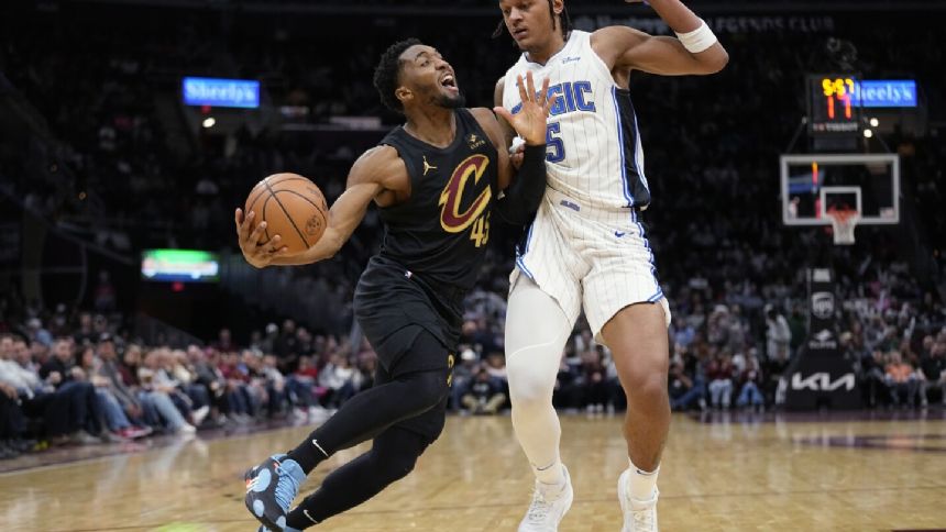 Donovan Mitchell scores 35 to lead Cavs to 121-111 over Magic, who get 42 points from Paolo Banchero