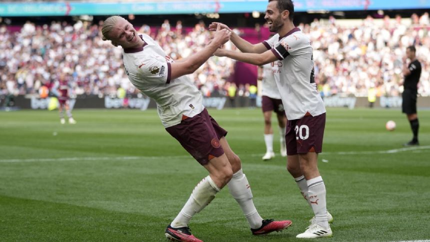 Double late strike keeps Manchester City top of the Premier League with a 3-1 win over West Ham