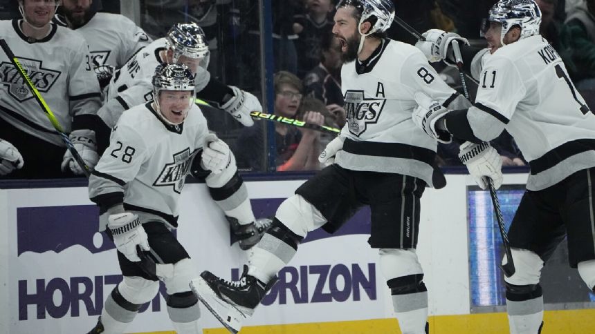 Doughty scores 33 seconds into OT, Kings rally past Blue Jackets 4-3 for 10th straight road win