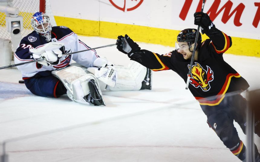 Dube scores in OT, Flames beat Blue Jackets 4-3