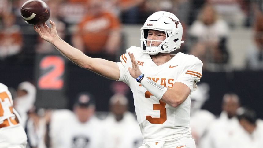 Ewers throws 4 TDs as No. 7 Texas bids farewell to Big 12 with 49-21 title win over Oklahoma State