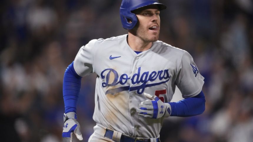 Freeman reaches 100 RBIs and Dodgers beat Rockies 8-2 to near 3rd straight 100-win season