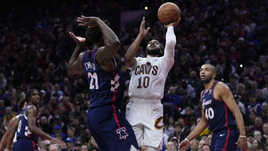 Garland leads shorthanded Cavaliers to 122-119 win over 76ers in overtime