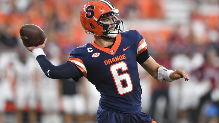 Garrett Shrader passes for four touchdowns in Syracuse's 65-0 rout of Colgate in season opener.