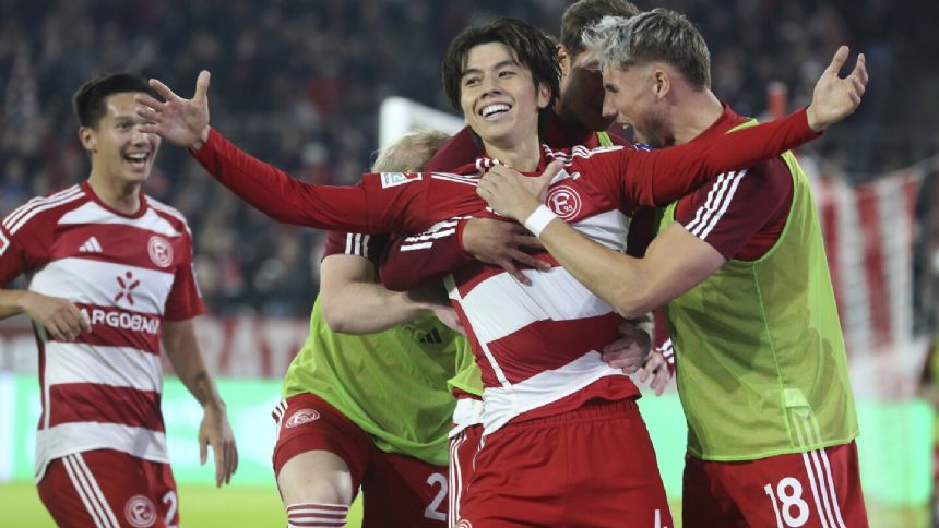 German soccer club gives away tickets for crowd of 52,000 to connect with its community