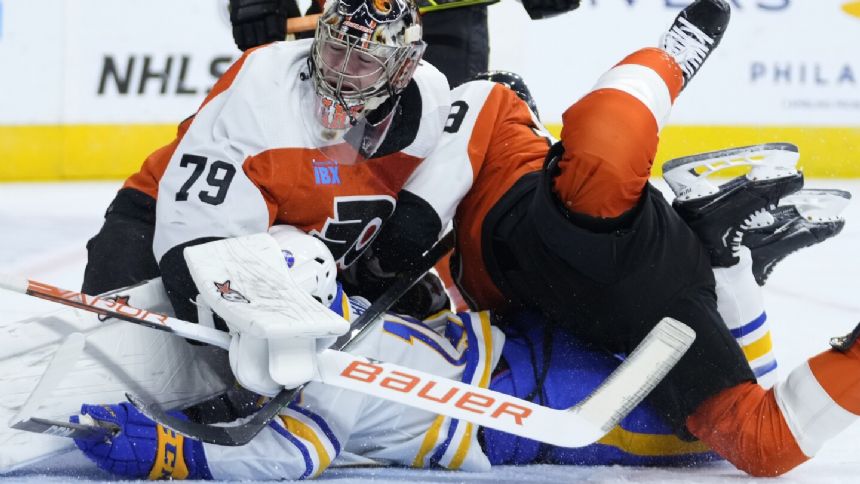 Goaltender Hart leaves Flyers game early with "mid-body" injury