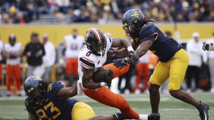 Gordon romps for 282 yards, 4 TDs, Oklahoma State outlasts West Virginia 48-34